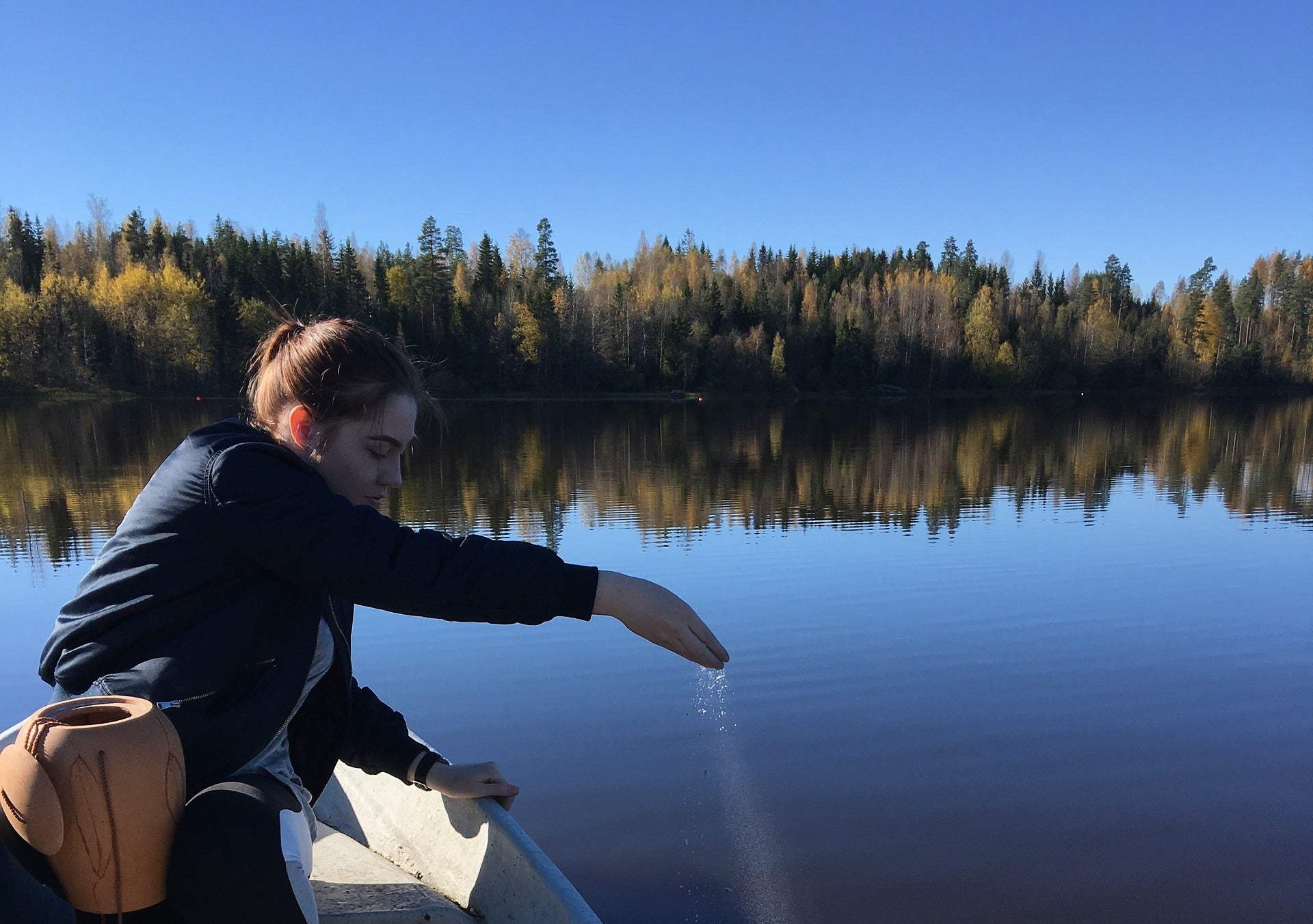 Scattering ashes over a lake. Pulvis Art Urns Blog